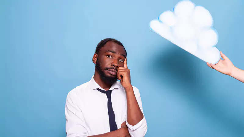 thoughtful-nurse-considering-remote-vs-on-site-career-options-under-cloud-cutout